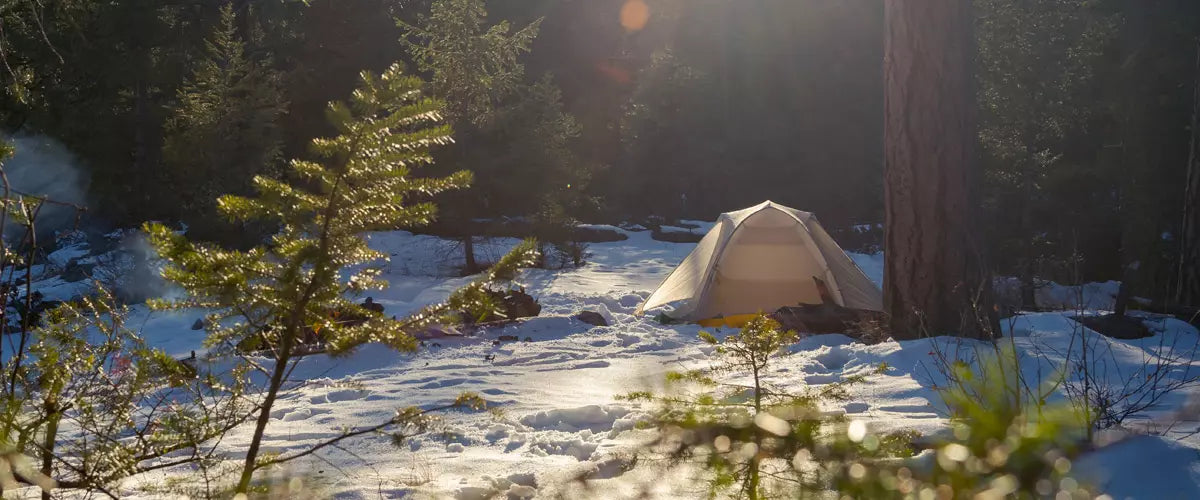 Discover the essentials for winter camping: from base layers to sherpa lined flannel. Stay warm, safe, and stylish on your snowy adventures with our comprehensive guide.