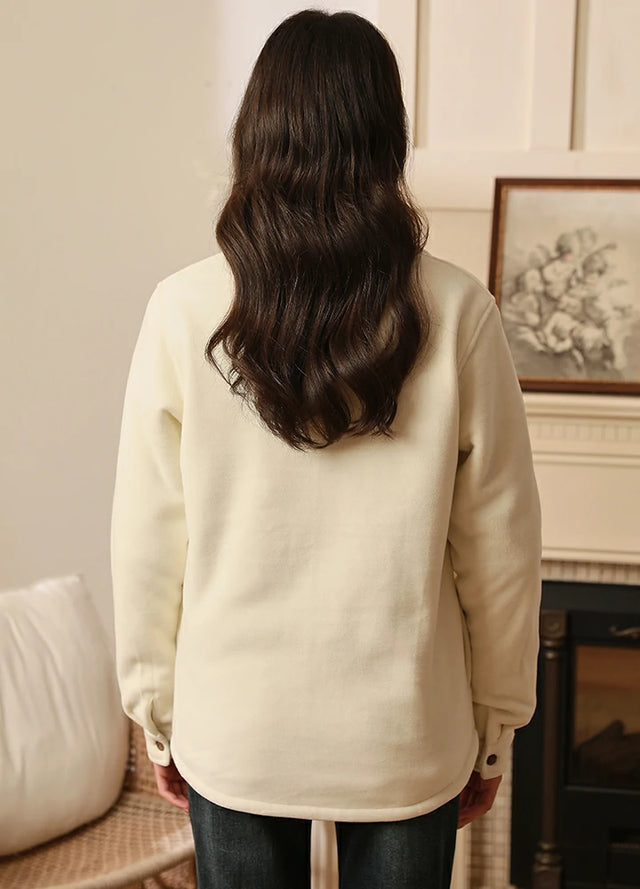 Back view of a woman in a cream flannel-lined corduroy shacket