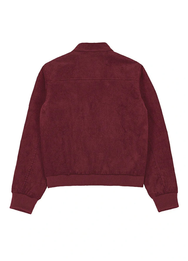Back view of a womens burgundy zip up corduroy jacket with long sleeves
