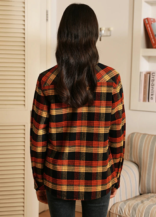 Back view of women in a red black button up flannel plaid shirt