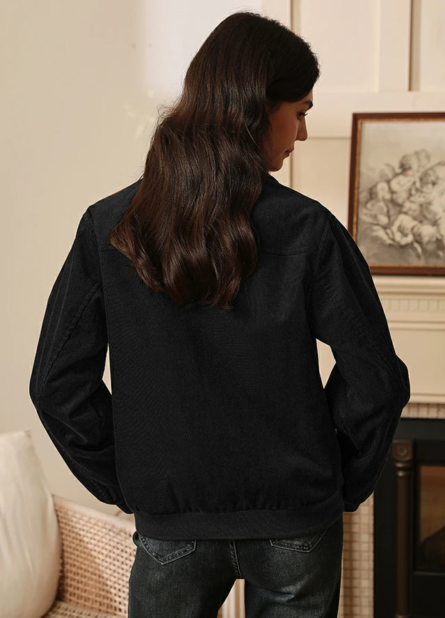 Back view of women in a black flannel lined corduroy jacket