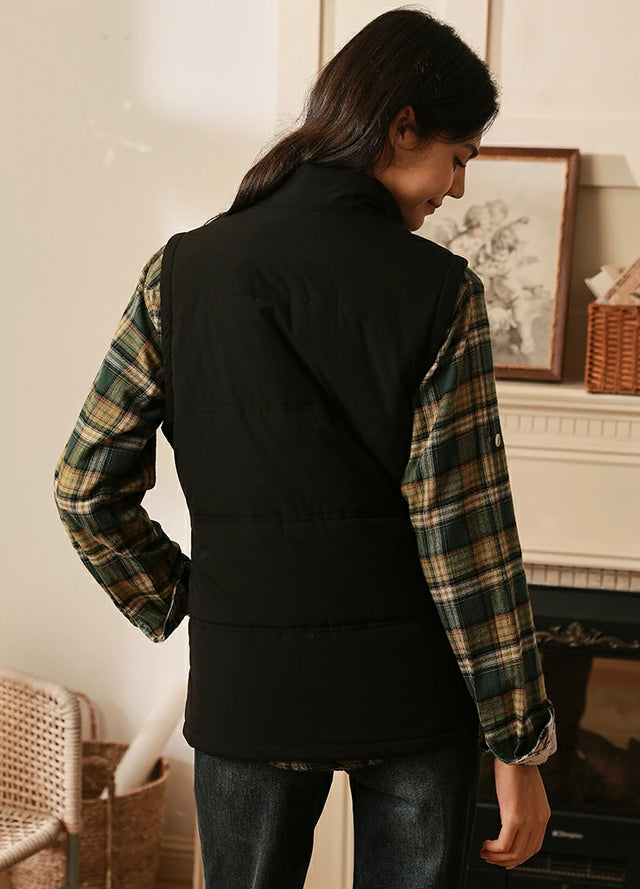 Back view of women in a black full-zip lightweight puffer vest