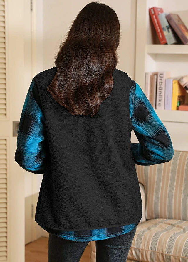 Back view of women in a black full-zip sherpa-lined fleece vest