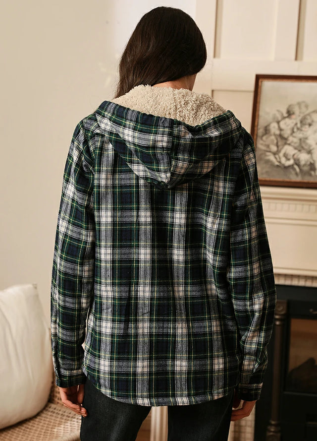 Back view of women in a green plaid sherpa lined hooded jacket