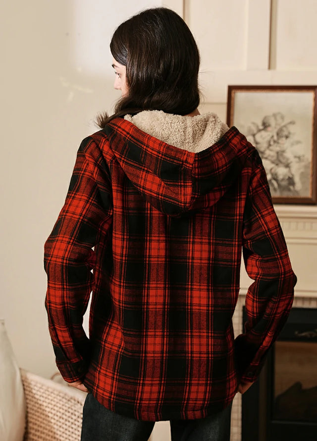 Back view of women in a red black sherpa lined hooded jacket