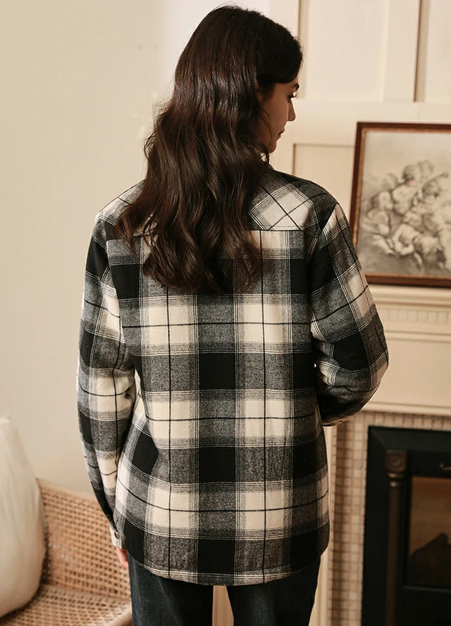 Back view of women in a winter warm white black flannel jacket