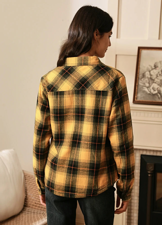 Back view of women in a yellow button down flannel shirt jacket