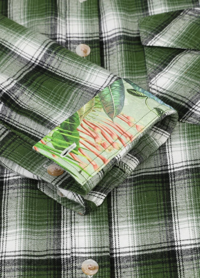 Close-up of men's forest green flannel shirt printed cuffs