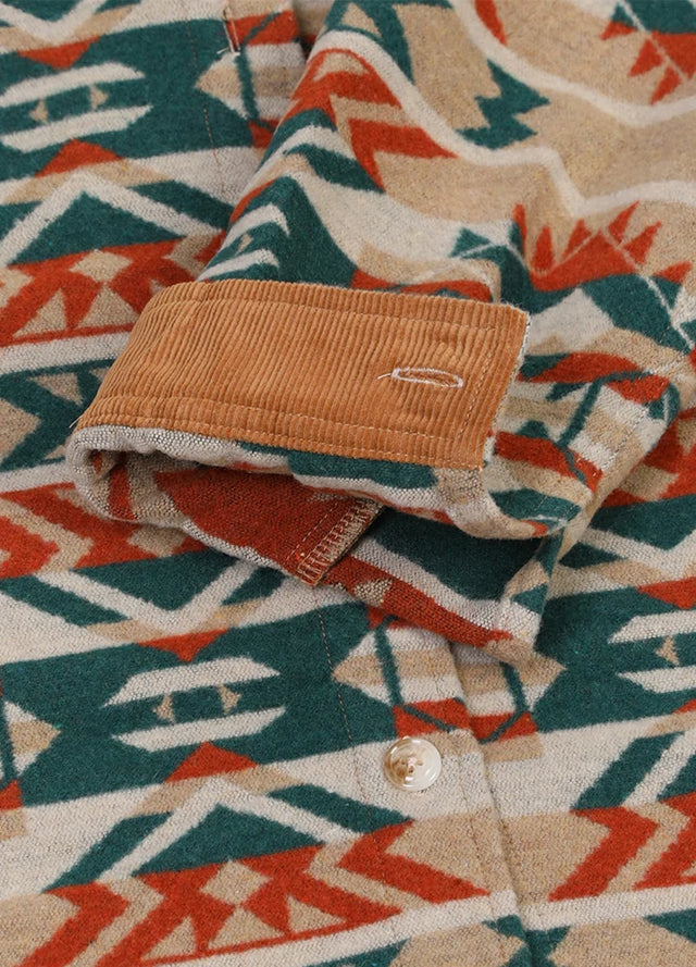 Close-up of the rolled-up cuffs on a women's khaki aztec warm shirt