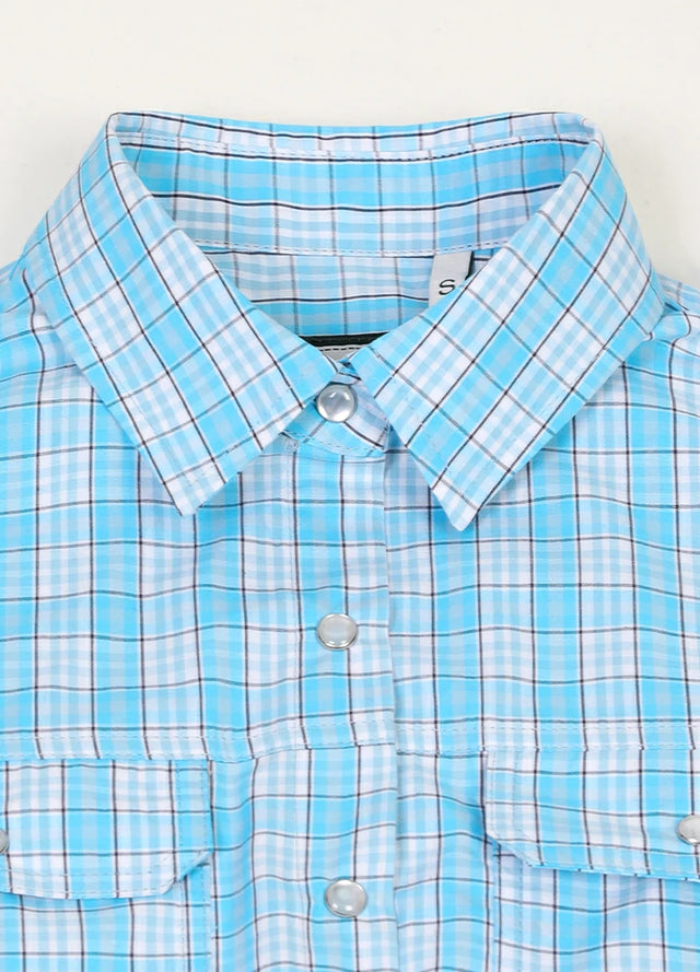 Close-up of women's chest pocket pearl snap baby blue plaid vest collar