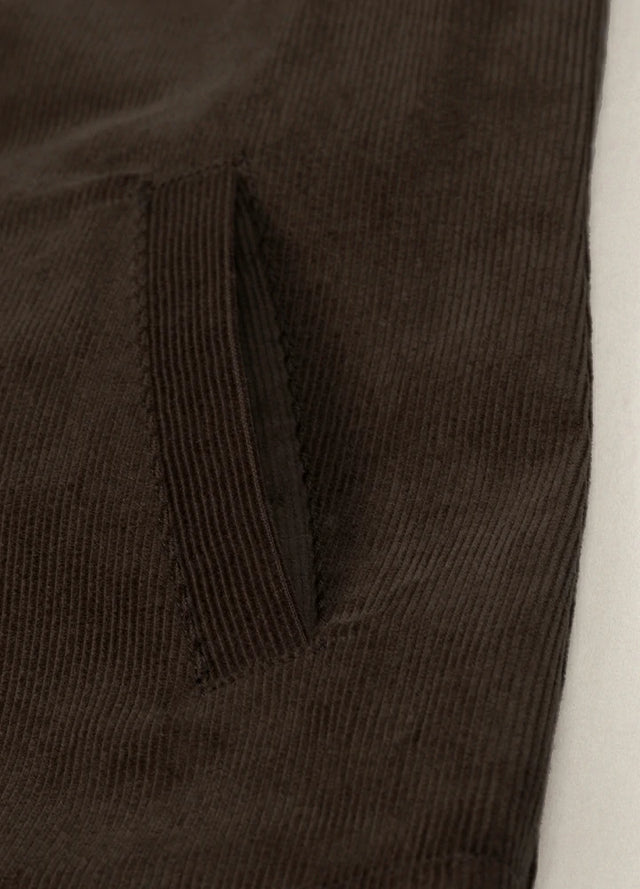 Close-up of women's dark brown corduroy shacket side pocket