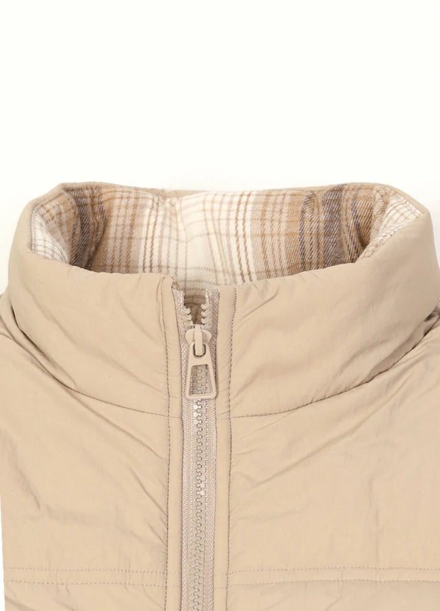 Close-up of women's khaki flanne lined zip-up puffer vest collar