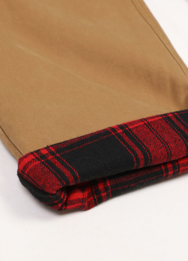 Close-up of women's khaki flannel lining pants leg