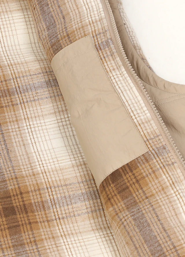 Close-up of women's khaki winter lightweight puffer vest inner pocket