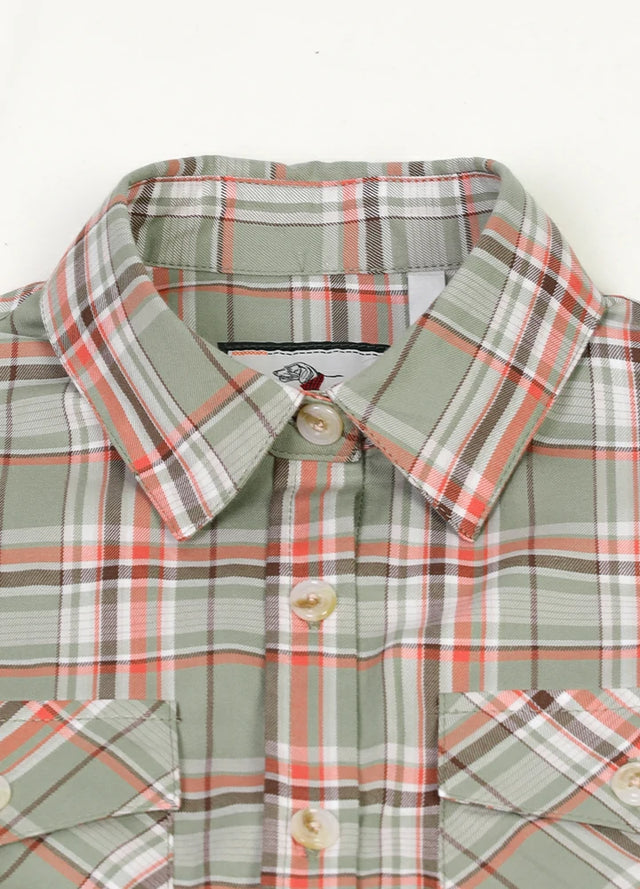 Close-up of women's teal green plaid flannel vest collar