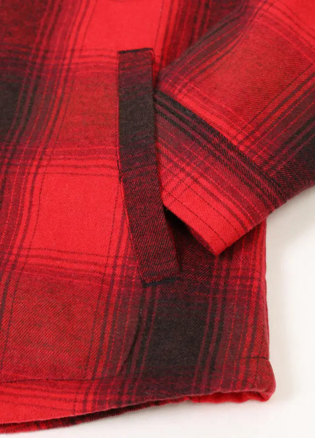 Close-up of women's red sherpa-lined flannel hooded jacket hand pocket