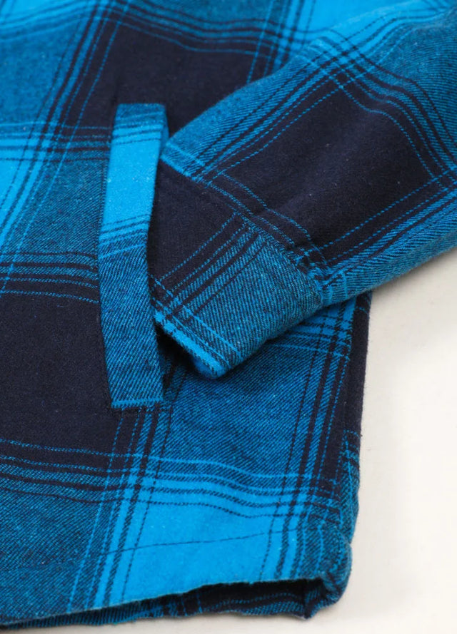 Close-up of womens blue plaid sherpa-lined flannel hooded hand pocket
