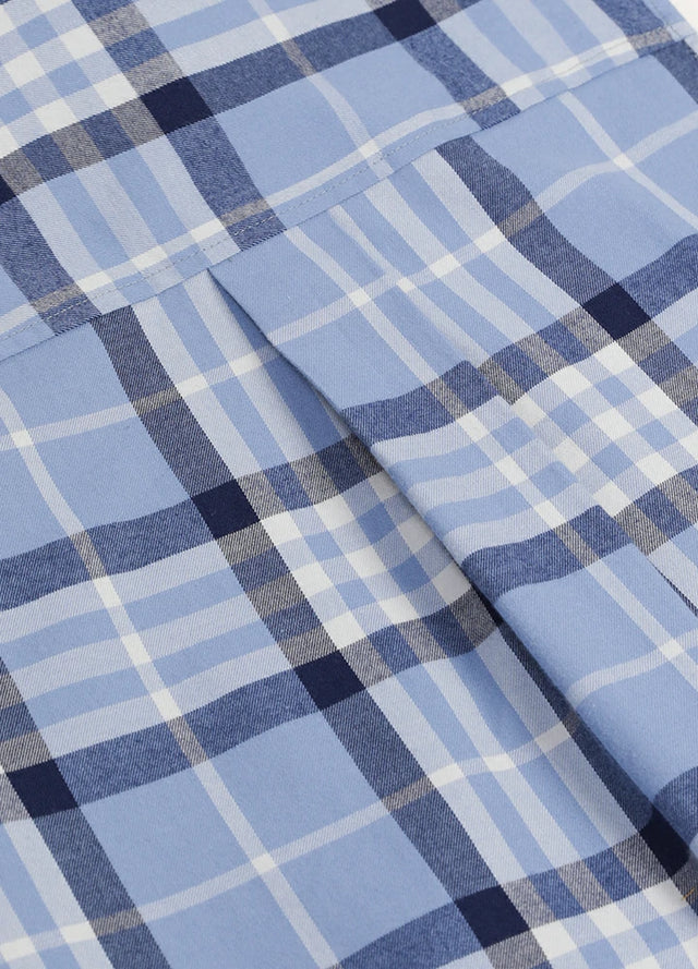 Close-up of womens pearl snap western blue plaid vest back design