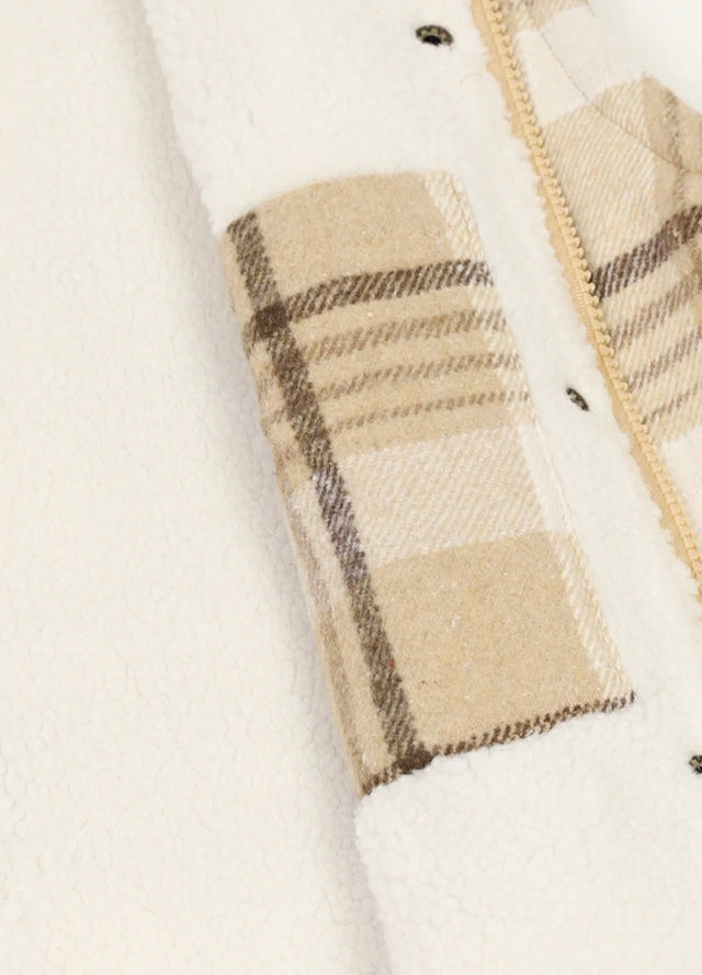 Detailed close-up of sherpa lined on the women's light khaki vest fabric
