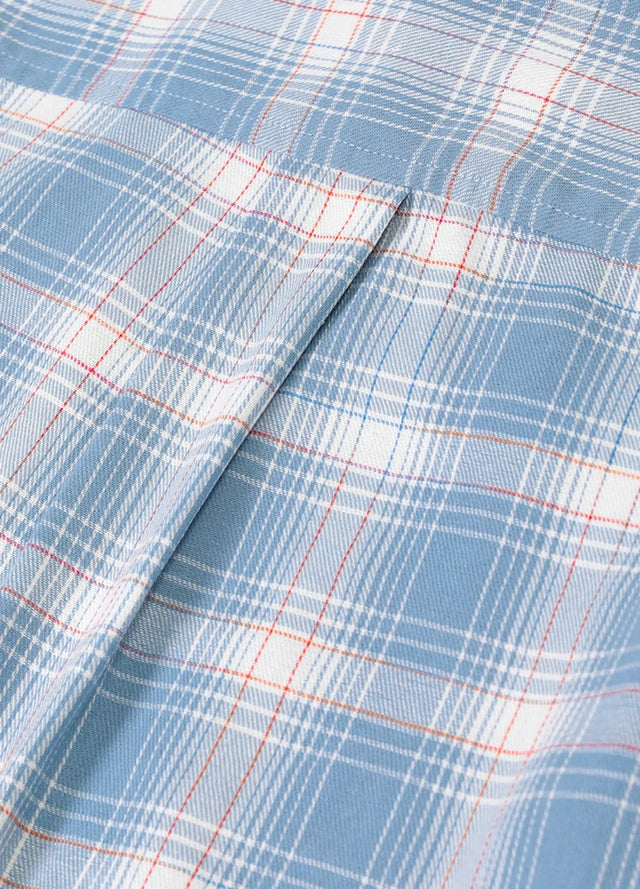 Detailed close-up of the women's flannel shirt fabric