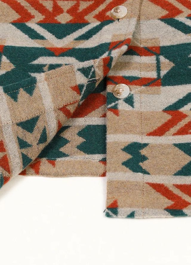 Detailed view of the placket on a women's khaki aztec wool-blend shirt jacket