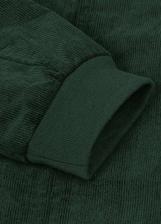 Detailed view of women's flannel lined soft dark green corduroy jacket cuffs