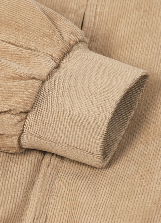 Detailed view of women's full zip up cozy khaki corduroy jacket cuffs