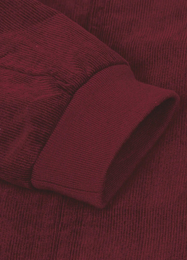 Detailed view of women's full zip up cozy burgundy corduroy jacket cuffs