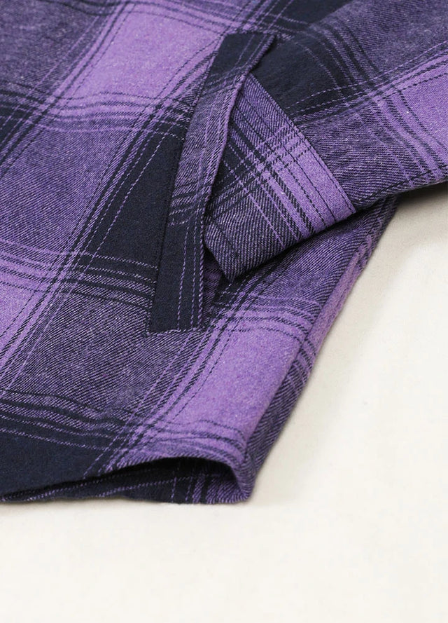 Detailed view of women's purple plaid flannel shirt hooded hand pocket