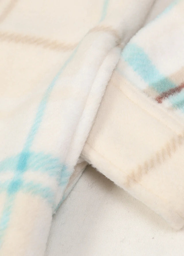 Detailed view of womens cream button down plaid shacket hand pocket