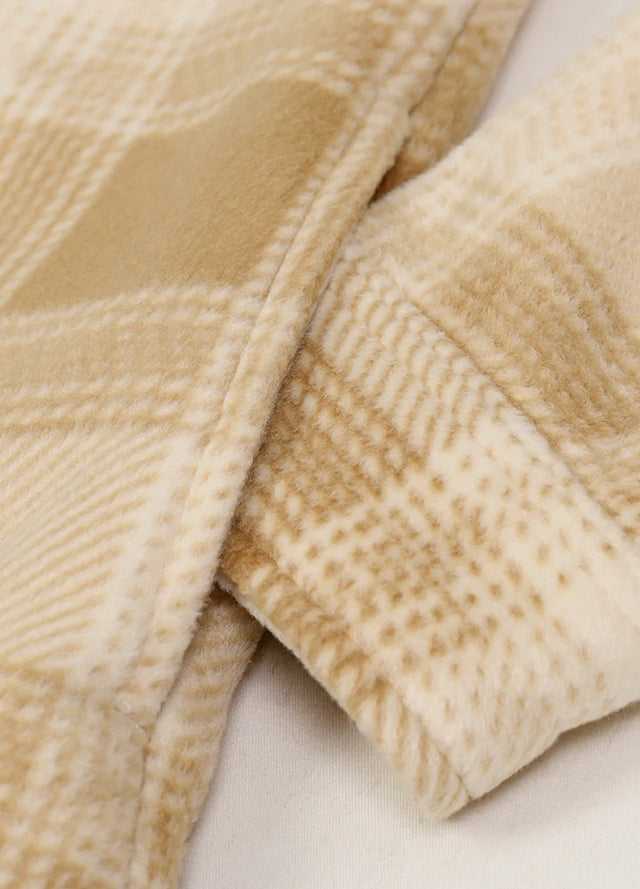 Detailed view of womens yellow button down plaid shacket hand pocket