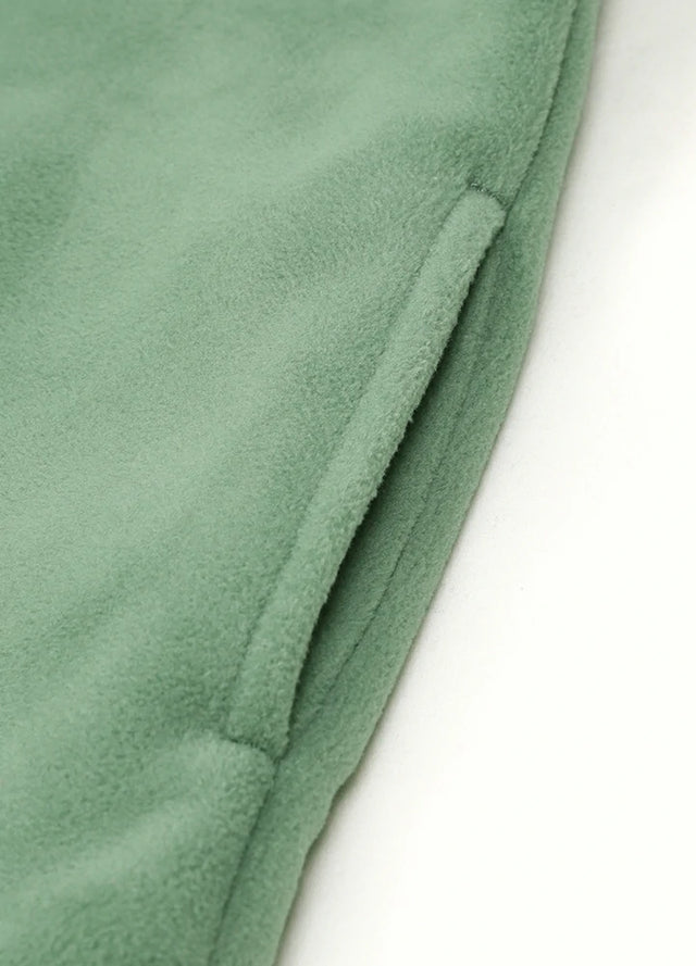Detailed view of womens forest green sherpa lined fleece shacket hand pocket