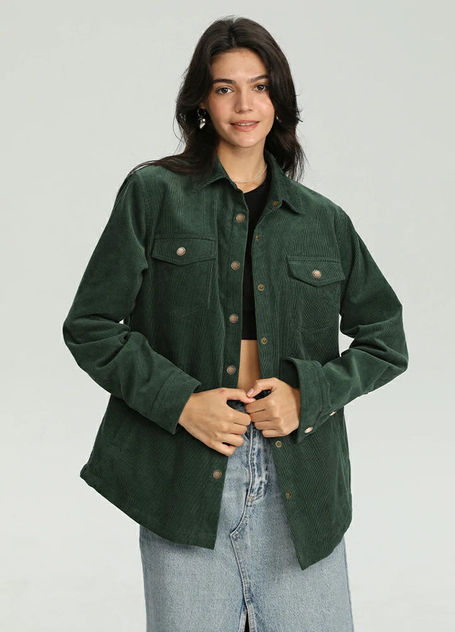 Woman wearing a dark green corduroy shirt jacket with flannel lining