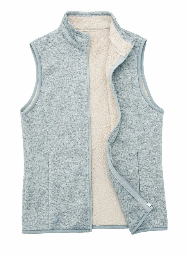 Front view of a women's green gray sweater fleece vest with sherpa lined