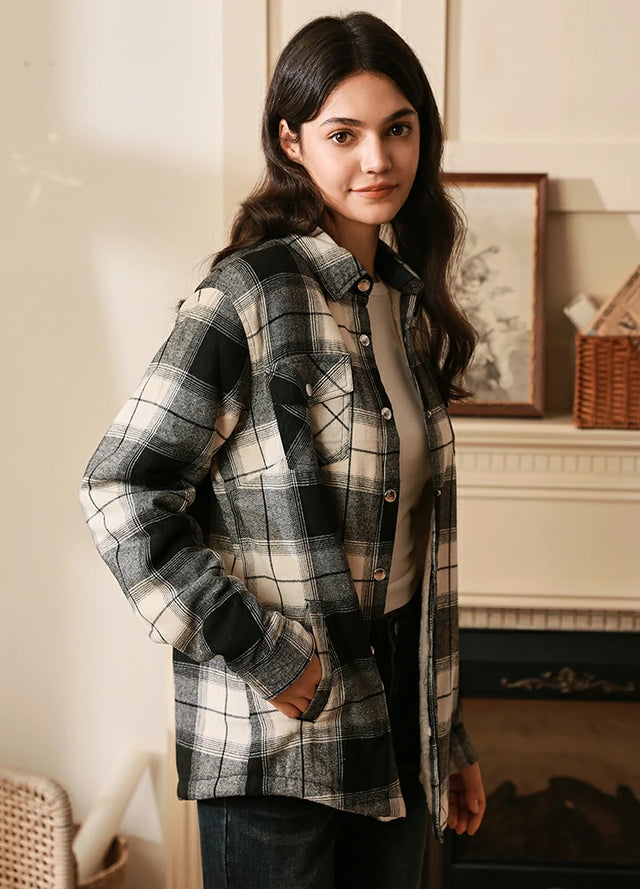 Side view of women in a white black winter flannel shacket