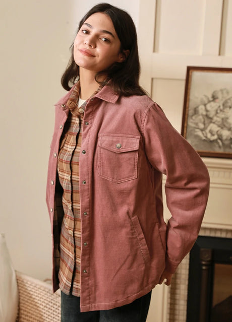 Woman wearing a pink corduroy shirt jacket with flannel lining
