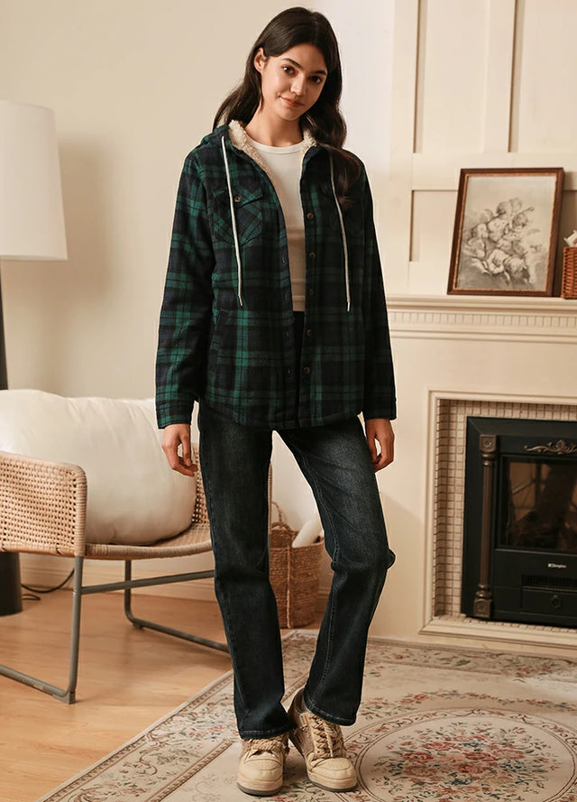 Women in a green and black button down flannel jacket with hood