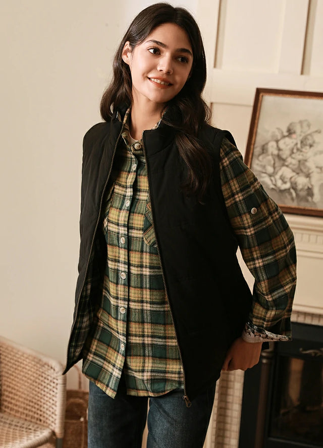 Women in a black water repellent flanne-lined puffer vest