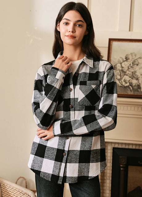 Women in a black white brushed heavyweight plaid flannel shirt