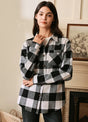 Women in a black white brushed heavyweight plaid flannel shirt