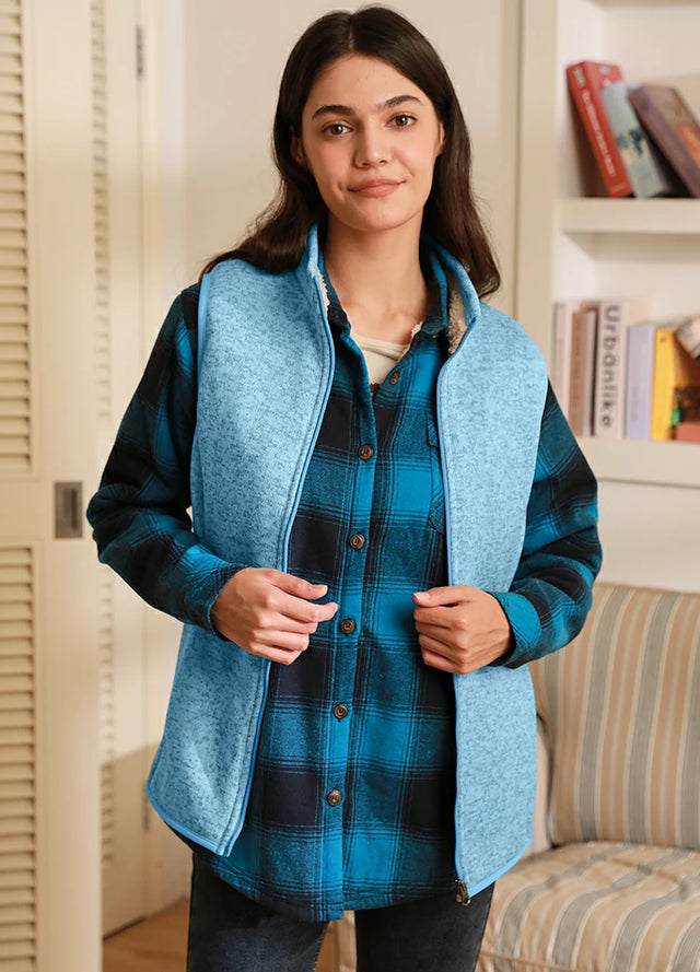 Women in a baby blue warm sherpa lined sweater fleece vest