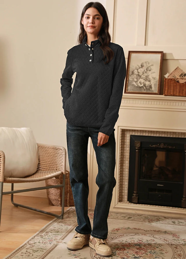 Women in a solid black long-sleeves warm quilted fleece pullover