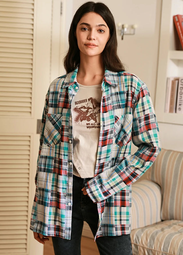 Women in a irregular plaid patchwork style white and blue plaid shirt