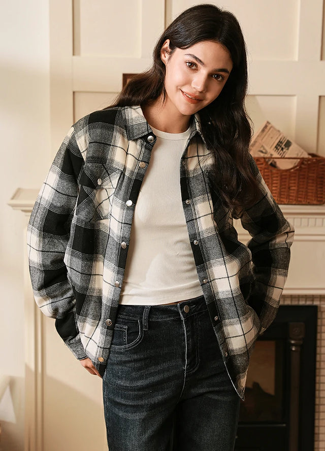 Women in a white black snap flannel jacket with sherpa lined