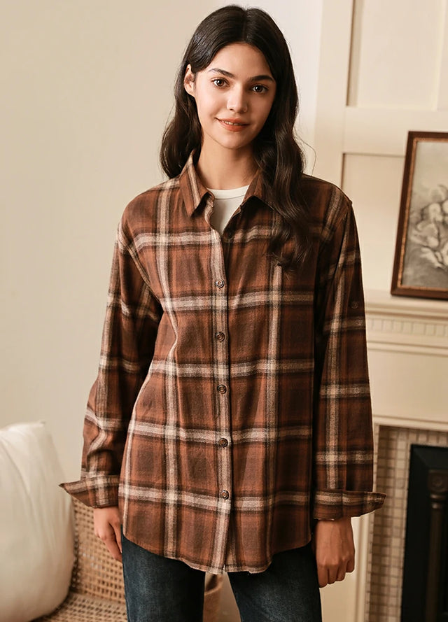 Women in a brown long sleeves flannel plaid shirt with button down