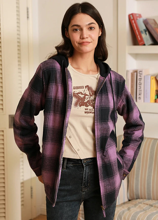 Women in a purple sherpa-lined flannel jacket with fleece hood