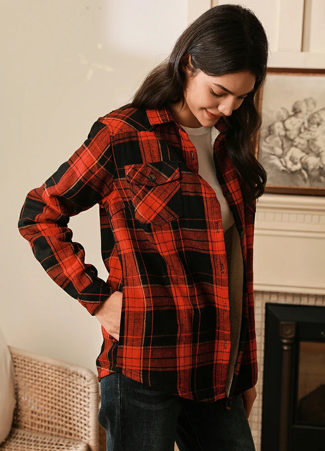 Side view of women in a black and red sherpa-lined flannel shirt jacket