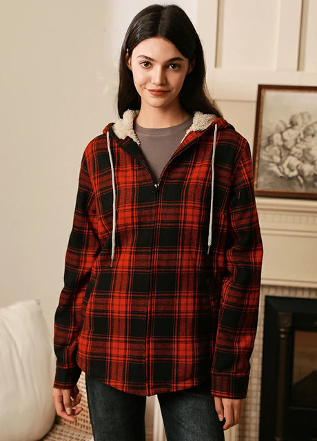 Women in a red black sherpa-lined flannel plaid jacket with hood