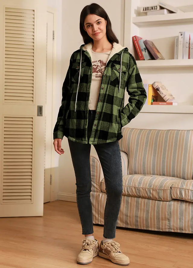 Women in a womens black and green button down flannel jacket with hood