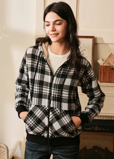 Women wearing a black full zip plaid hooded jacket with sherpa lined